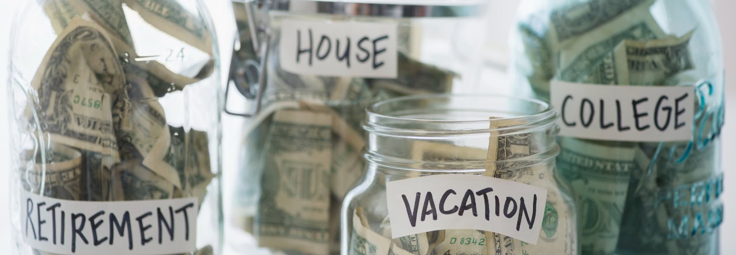 jars of money with Retirement, House, College and Vacation labels