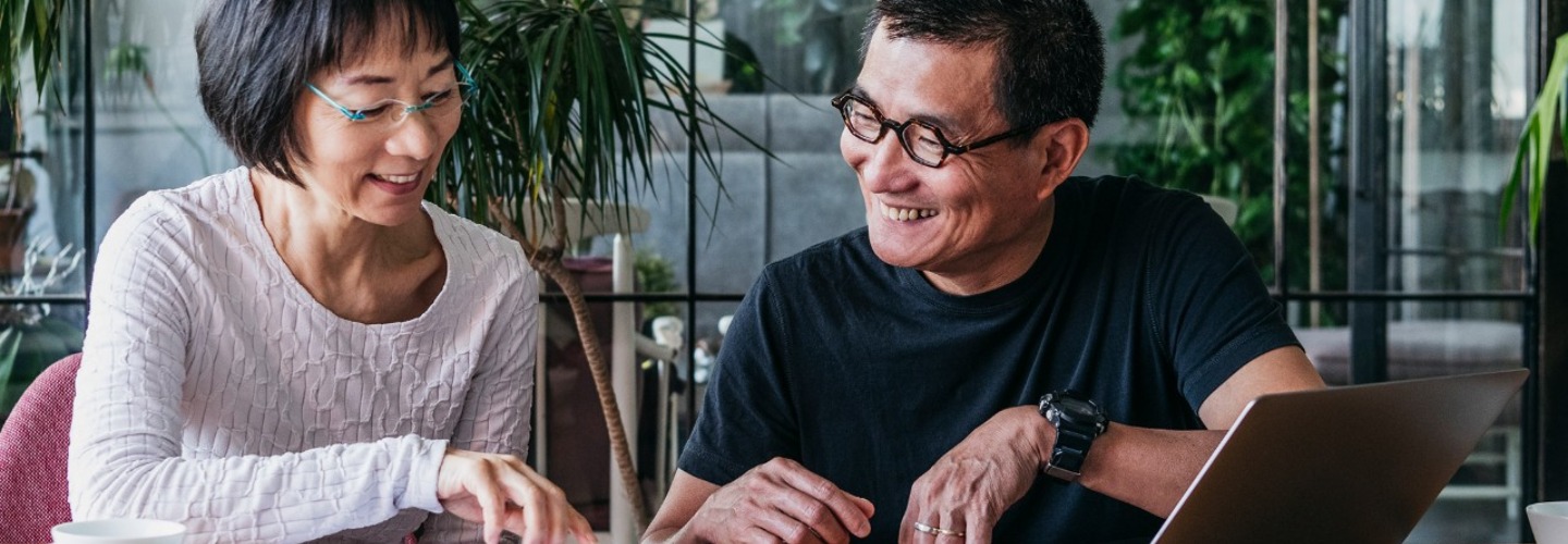 A couple reviewing online documents