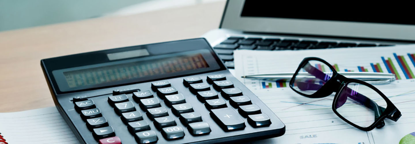 a calculator with reading glasses to the right side